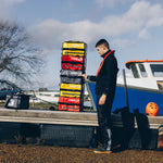 KitBrix transition bag on wet ground, demonstrating the waterproof BaseBrix™ base that ensures contents stay dry and protected.